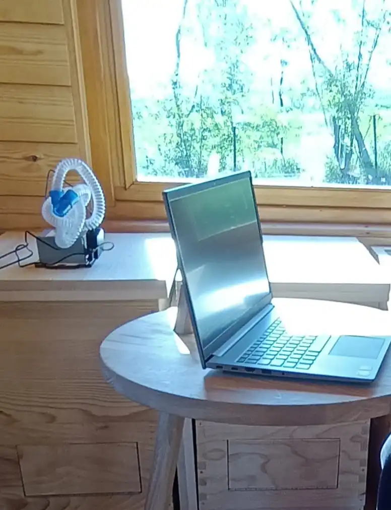 a laptop standing on the desk